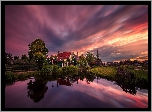 Holandia, Wiatrak, Domy, Rzeka, Drzewa, Zachód słońca, Skansen Zaanse Schans