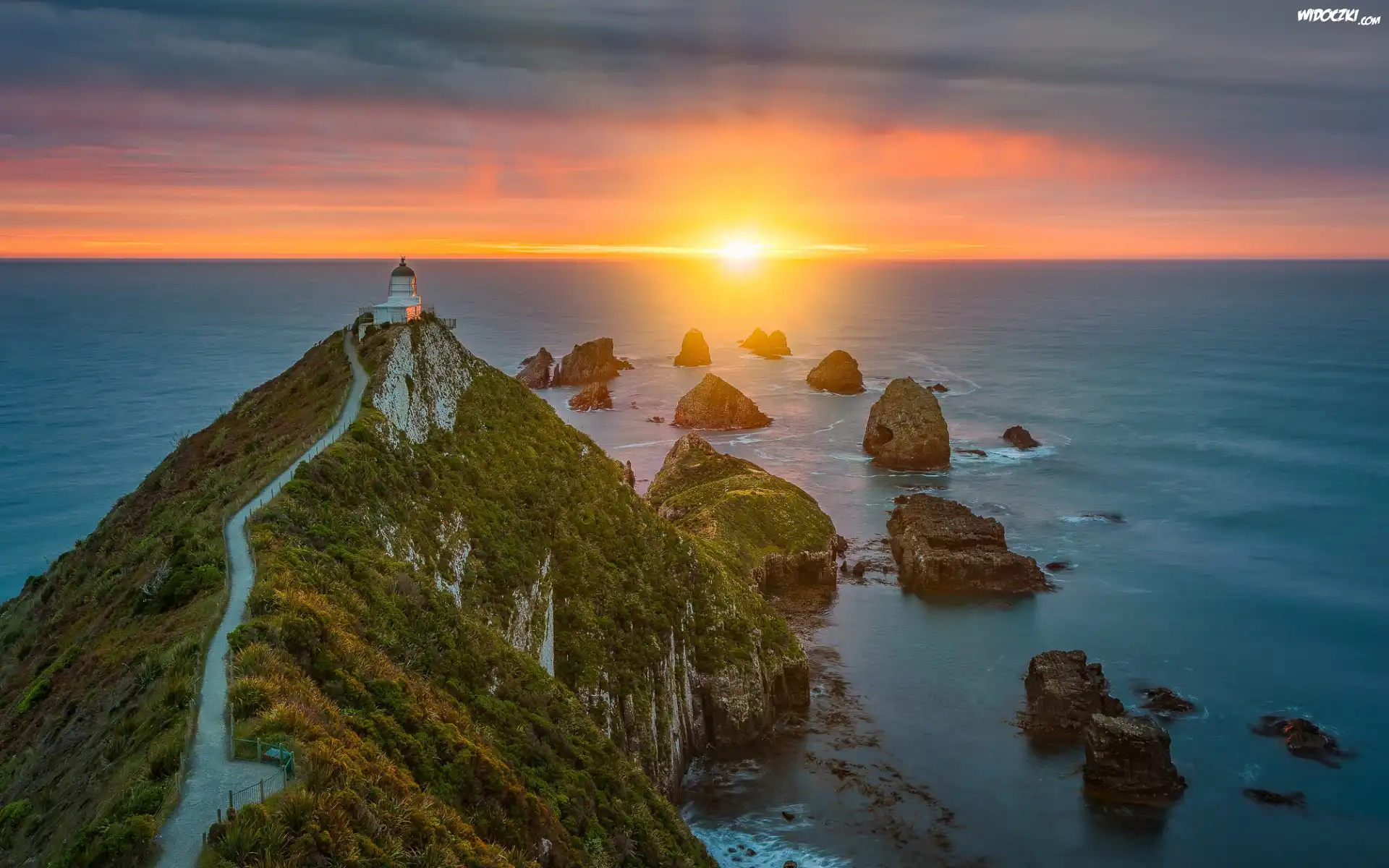 Nowa Zelandia, Region Otago, Latarnia morska, Nugget Point Fighthouse, Morze, Wschód słońca, Skały